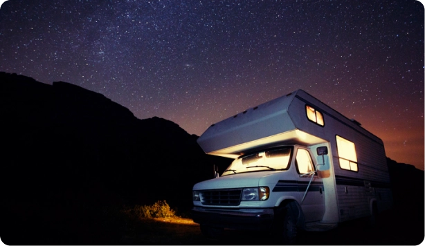 RV at nighttime with stars above