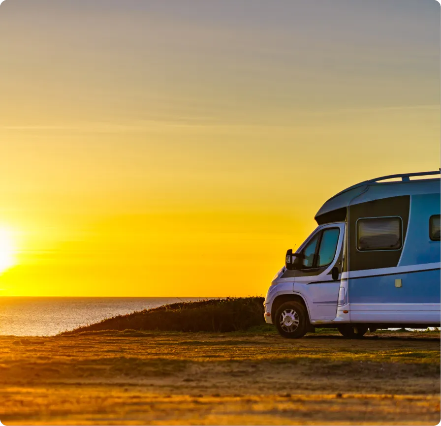 RV parked overlooking sunset